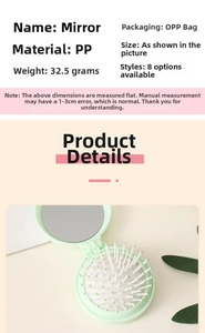 Macro detail of foldable pastel green round hairbrush with built-in mirror and massage bristles