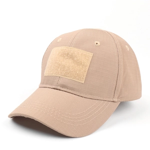 Macro detail of khaki ripstop fabric and front velcro patch area on tactical cap