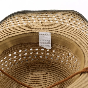 Detail view of woven paper sun hat interior with 100% paper tag and sweatband