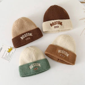 Detailed knit texture and embroidered BOSTON 1630 lettering on winter beanies