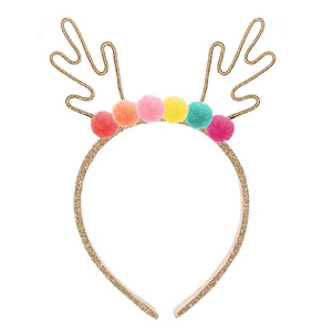 Close-up of golden reindeer antlers headband with colorful fuzzy pom-poms for Christmas