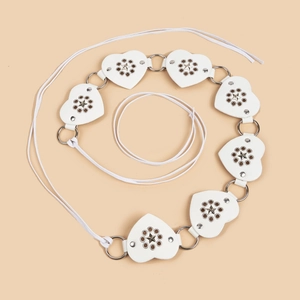 White heart link belt featuring metallic star studs and circular rings on beige backdrop