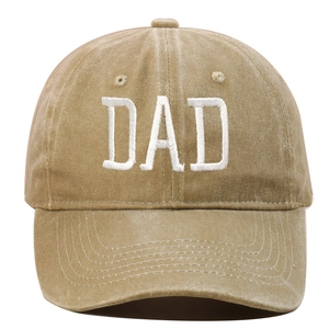 Detailed close-up of white 3D DAD embroidery on a khaki washed cotton baseball cap