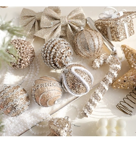Detailed close-up of champagne gold glitter Christmas ornaments and festive decorations