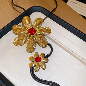 Fashion long gold flower pendant necklace with red crystals and black woven cord