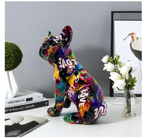 Close-up of a colorful graffiti resin French bulldog sculpture with LOVE pattern detail