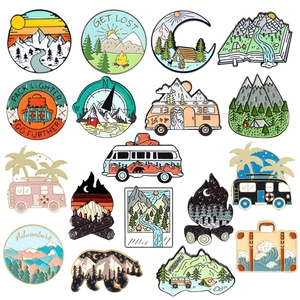 Set of 15 outdoor adventure enamel pins featuring mountains and camping themes