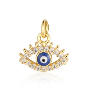 Detailed view of a gold evil eye pendant with blue enamel and zircon inlay