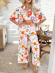 Close-up of lightweight floral print short-sleeve shirt and wide-leg pants set