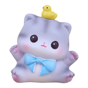 Cute gray pudding cat desktop ornament with blue bow and tiny yellow chick on its head