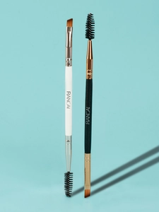 Macro view of dual-ended eyebrow brushes with angled bristles and spiral mascara spoolies