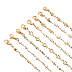 Adjustable golden stainless steel bracelets with heart and star charms set on white background