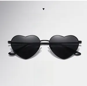 Detail view of heart-shaped sunglasses with E80 model code on the inner metal temple