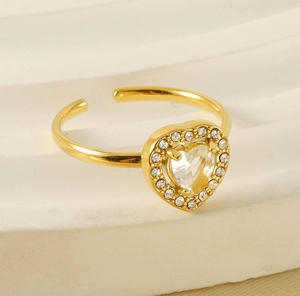 Macro shot of gold-plated 18K stainless steel open heart ring with sparkling zircons