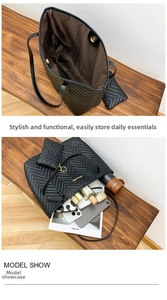 Close-up of black quilted tote bag with magnetic closure and matching zipper pouch