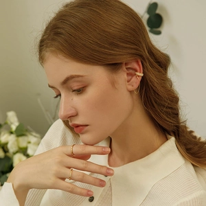 Elegant gold-plated brass ear cuff chain and minimalist gold rings with white cubic zirconia