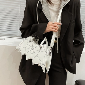 White PU leather bag with bat wing design shown in hand and crossbody styles