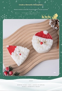 Close-up of Santa Claus scented candles on a wooden tray with festive pine cones