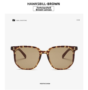 Front view of retro square brown sunglasses with tortoiseshell frames and gold rivets