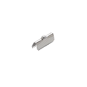 Macro shot of silver stainless steel ribbon end clamp with textured surface and teeth