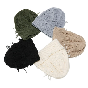 Distressed knit beanies in five colors showing retro ripped textures and streetwear style