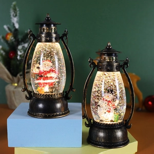 Vintage bronze Christmas lanterns with Santa and Snowman scenes and glowing LED glitter