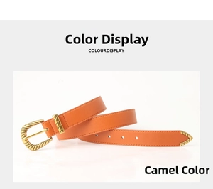 Detail of camel leather belt with golden engraved metal buckle and textured loop