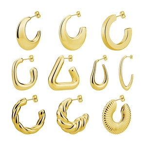 Collection of nine gold geometric earrings featuring smooth polished and ribbed textures