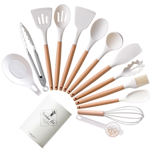 14-piece white silicone kitchen utensil set with natural wooden handles in storage bucket