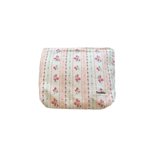 Floral cotton makeup bag with pink flowers and green stripes on cream fabric