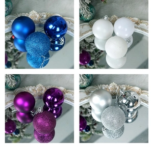 Detail of matte, glossy, and glitter Christmas ornaments in blue, white, purple, and silver