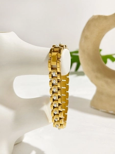 Detail of 18K gold titanium watch chain bracelet with inlaid white pearl accents