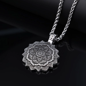 Macro shot of Viking mandala pendant with vintage silver finish and intricate engravings