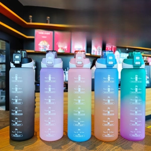 Detail view of five colorful 1000ml gradient frosted sport bottles with time markers