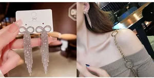 Detail of silver bow tassel earrings with sparkling rhinestones on model and display card
