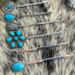 Close-up of bohemian turquoise hair clip set with 6 pieces on a natural fur background