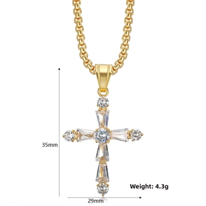 Detailed view of gold cross pendant with AAA zircon stones measuring 35mm by 29mm