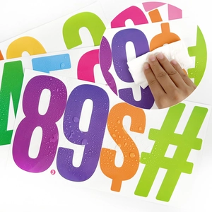 Waterproof detail of 6-inch colorful vinyl number stickers showing water resistance