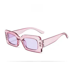 Detail view of pink translucent retro square sunglasses with light purple tinted lenses