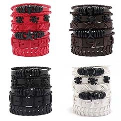 Detail view of four-set men's leather braided bracelets with skull and star charms