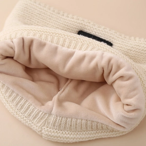 Three-piece winter knit set for kids featuring a fleece-lined beige hat with dual pompoms