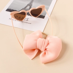 Pink heart-shaped sunglasses and matching large bow headband set for girls and infants