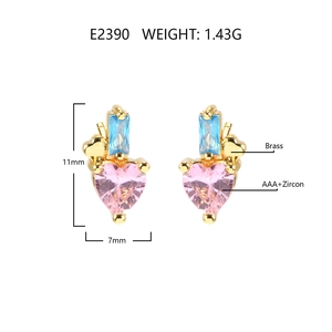 Detailed macro view of heart earrings featuring pink and blue zircon set in 18k gold plated brass