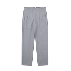 Detail of grey straight-leg trousers showing fabric texture and side pocket design