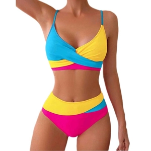 Two-piece color block bikini with cross-wrap top and high-waisted bottom in blue and pink