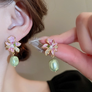Vintage floral drop earrings with pink enamel petals, green zircon, and baroque pearls