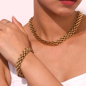 Three-layer braided gold stainless steel necklace and bracelet set on model