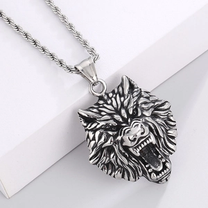 Close-up of a sculpted stainless steel wolf head pendant with detailed rope chain