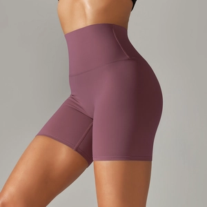 Detail of high-waisted wide waistband on plum purple stretchy athletic yoga shorts