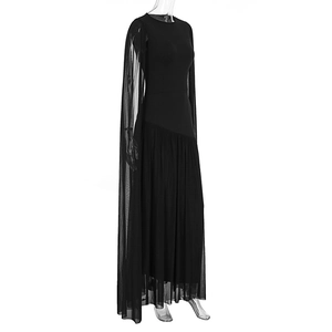Detail of elegant black floor-length dress with a long sheer mesh cape on the shoulder